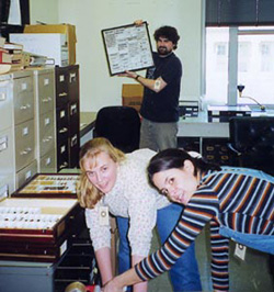 Mary Liz Jameson, Karla Villatoro, Andrew Smith looking at entomological boxes